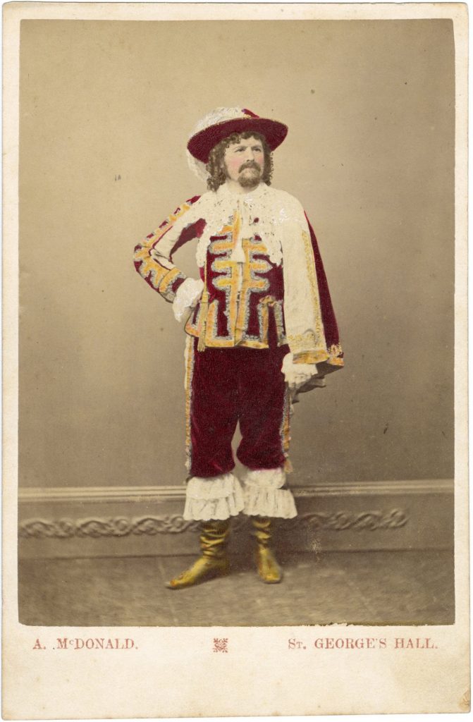 Hand-coloured photograph of G. G. Munro in fancy dress