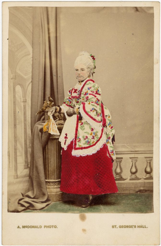 Hand-coloured photograph of Mrs G. G. Munro in fancy dress