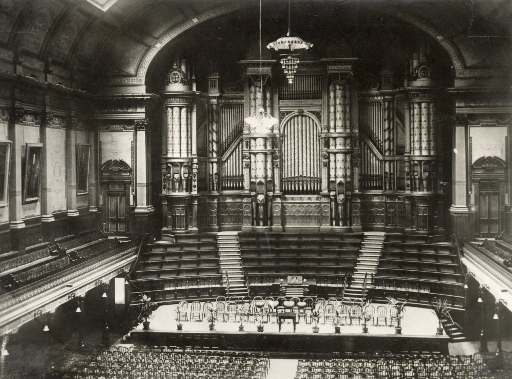 Image of the interior of Melbourne Town Hall, including the grand organ