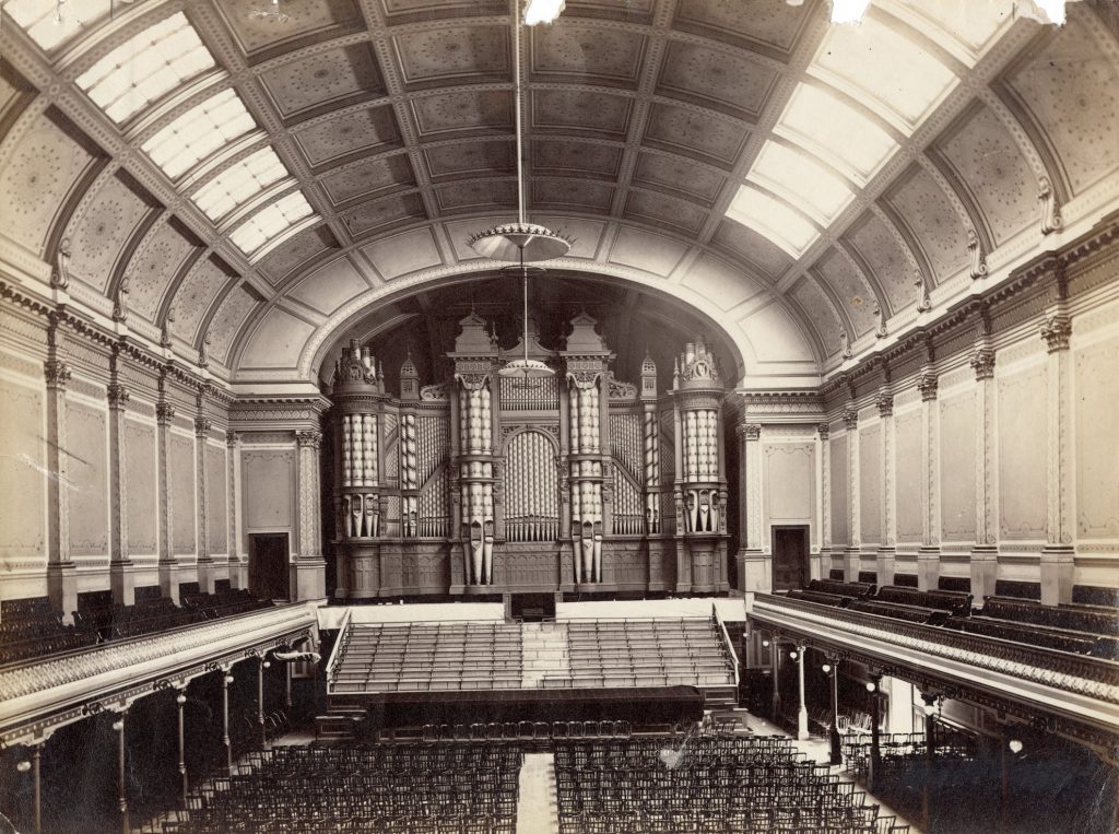 Image of the interior of Melbourne Town Hall, including the grand organ