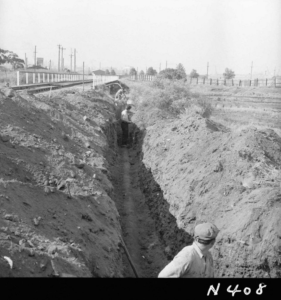 N408 Image showing installation of a drain under the railway, during construction of the Fish Market on Footscray Road