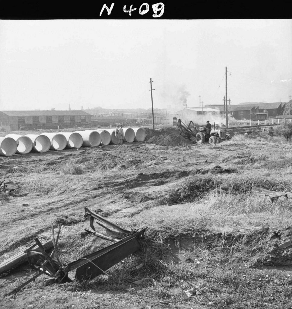 N409 Image showing installation of a drain under the railway, during construction of the Fish Market on Footscray Road