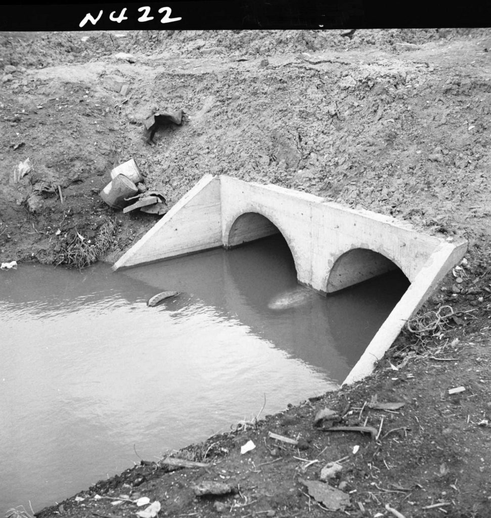 N422 Image showing a drain outlet to a creek, from the Footscray Road and railway culvert