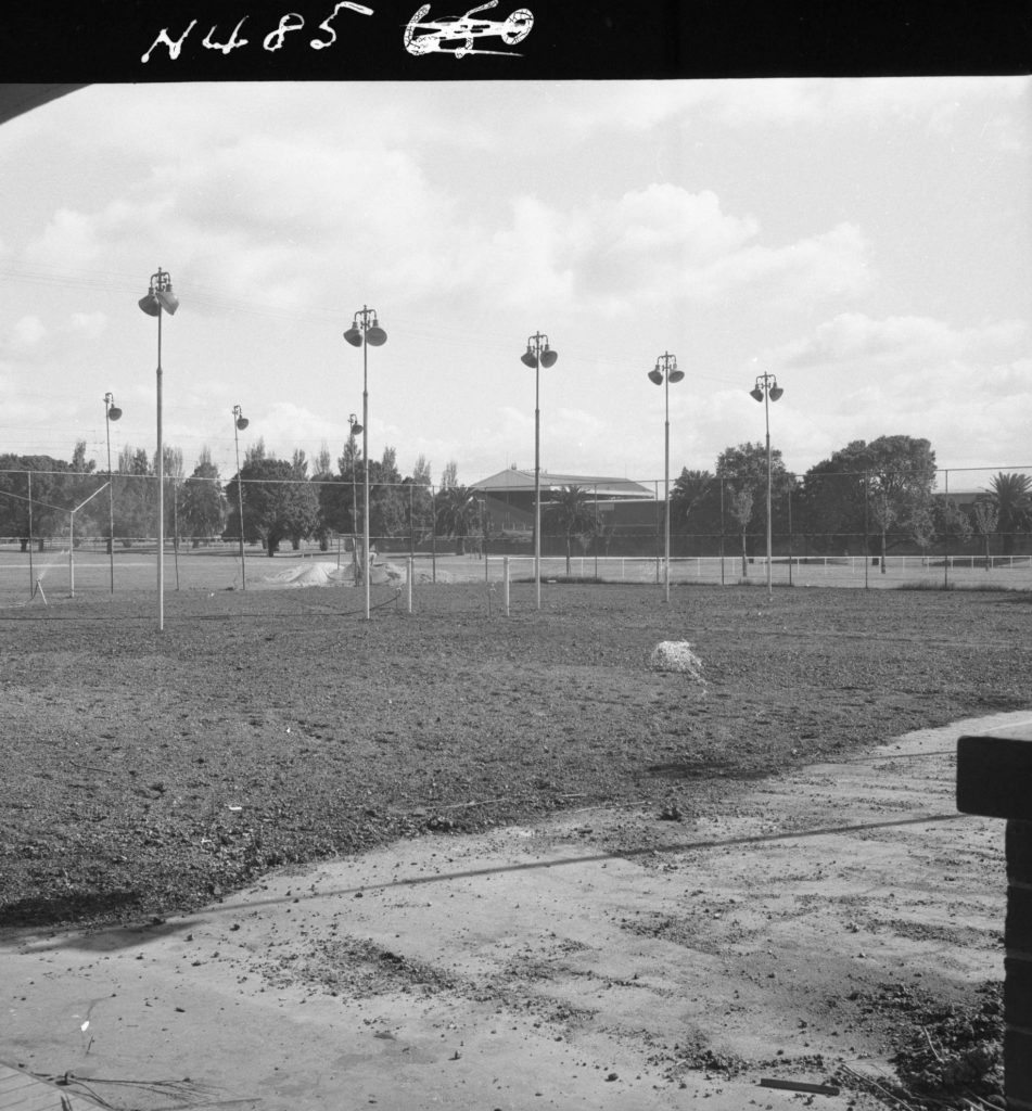 N485 Image showing an ash base laid preparatory to rolling, during construction of the Princes Park tennis courts