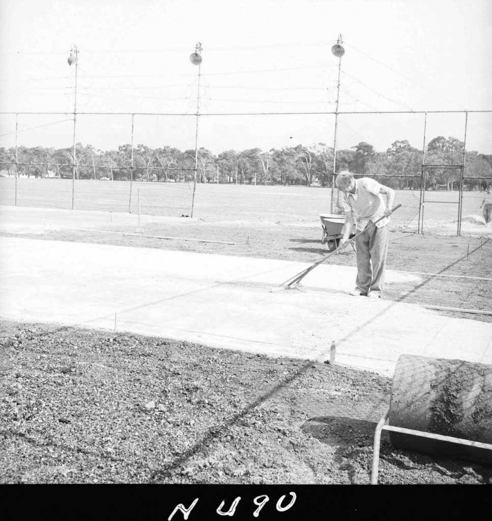 N490 Image showing spreading of the first porous surface during construction of the Princes Park tennis courts