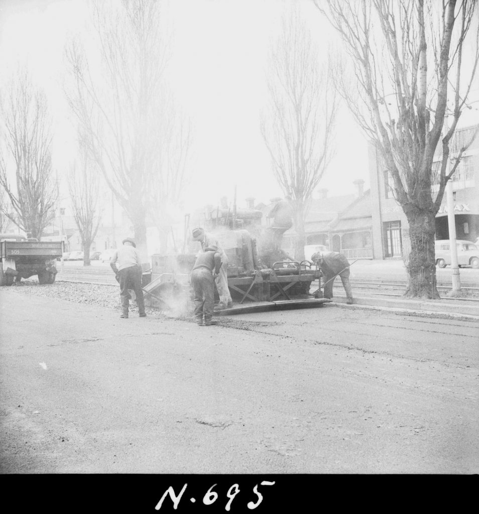 N695 Image showing a Barber-Greene road finisher spreading and laying asphalt