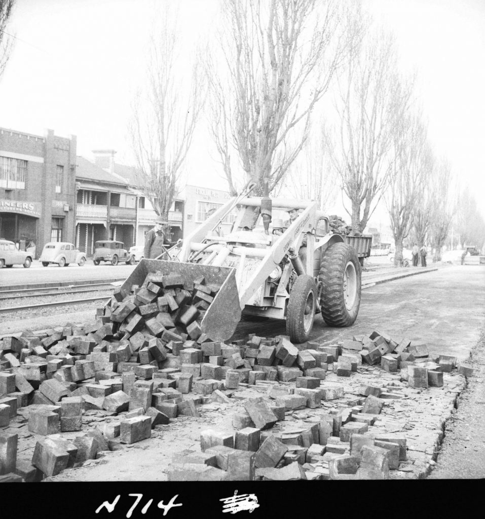 N714 Image showing a Cranvel front end loader removing wood blocks