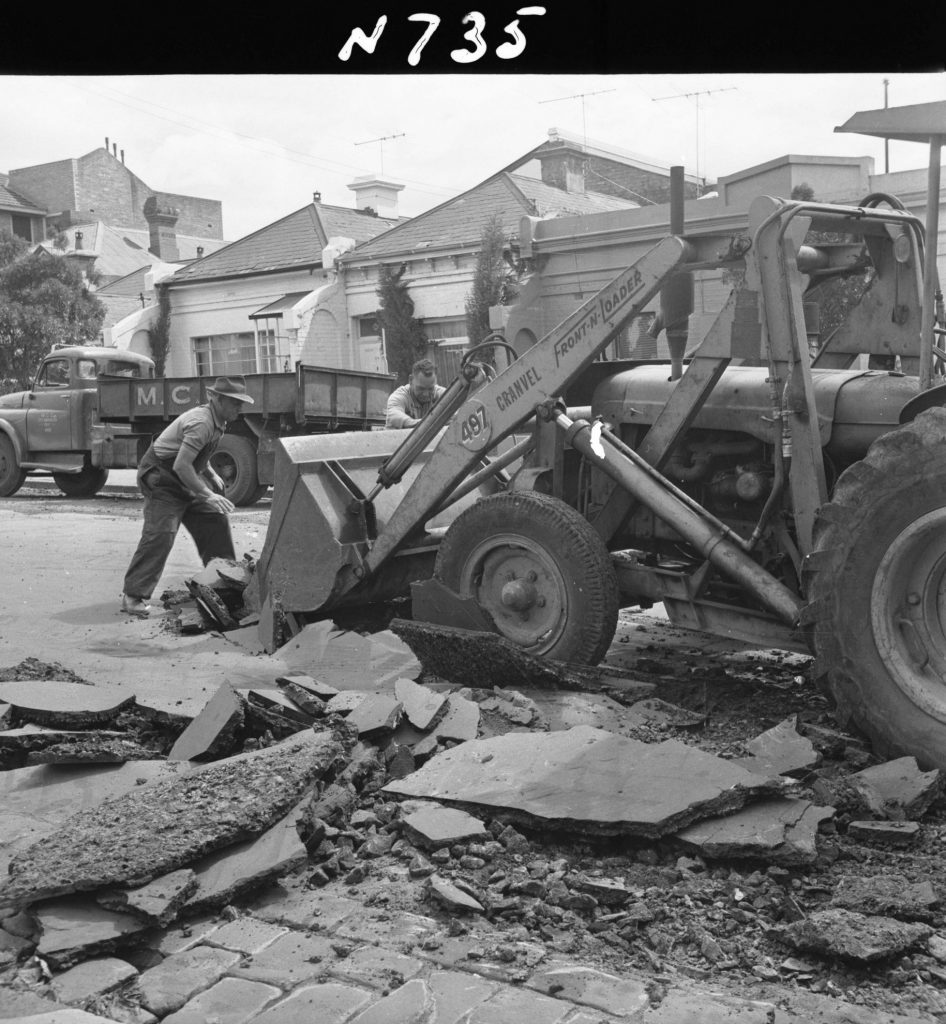 N735 Image showing a Cranvel front end loader scooping ripped asphalt