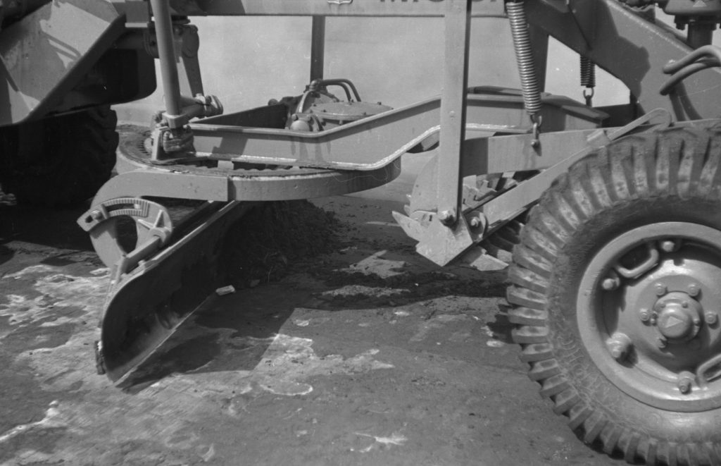 N742 Image showing a roadheater followed up by a grader, in use up until 1954