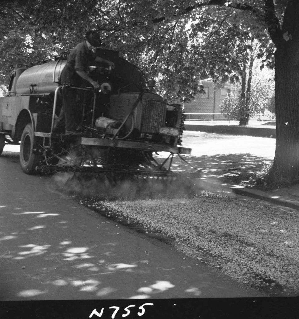 N755 Image showing the spraying of rubberised bitumen on a motor track on Royal Parade