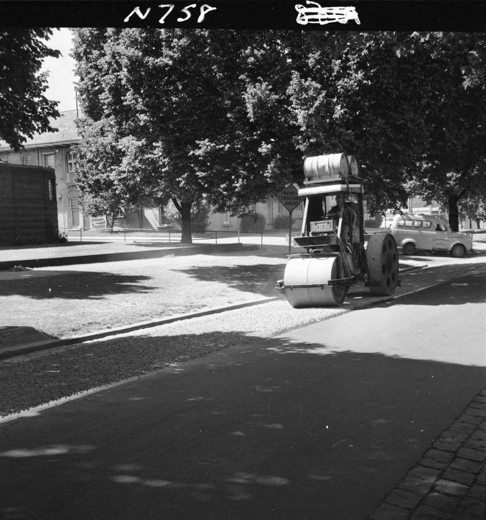 N758 Image showing metal being rolled on rubberised bitumen