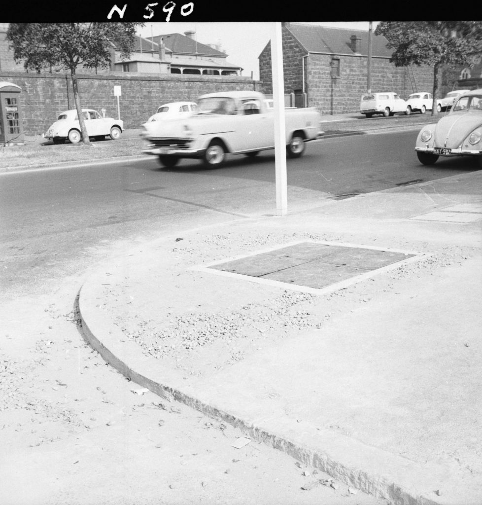 N590 Image showing footpath opening for the Postmaster-General trench on the corner of Albert Street and Lansdowne Street, East Melbourne