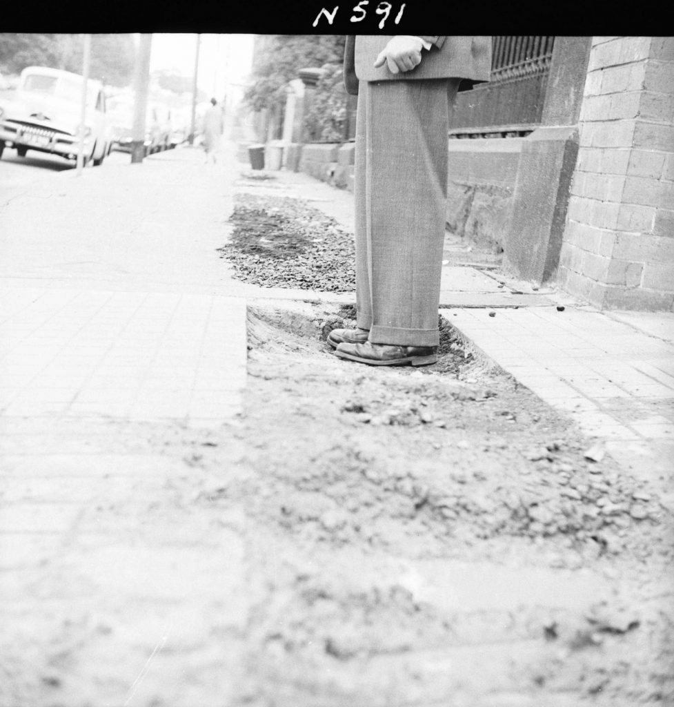 N591 Image showing footpath opening for the Postmaster-General trench on Albert Street, outside the Commonwealth Scientific and Industrial Research Organisation (CSIRO) building, East Melbourne