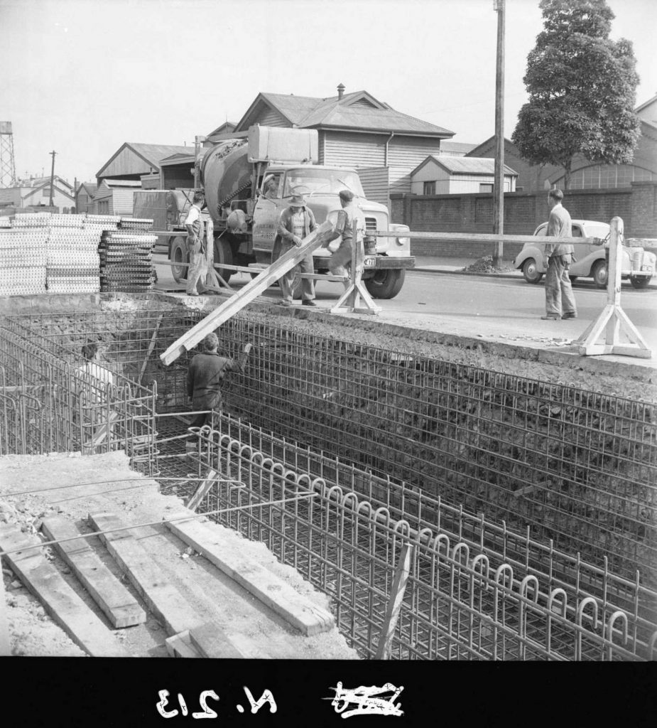 N213 Image showing preparations for the first ‘ready mix’ concrete pour for the floor slab, during construction of a weighbridge on Flinders Street