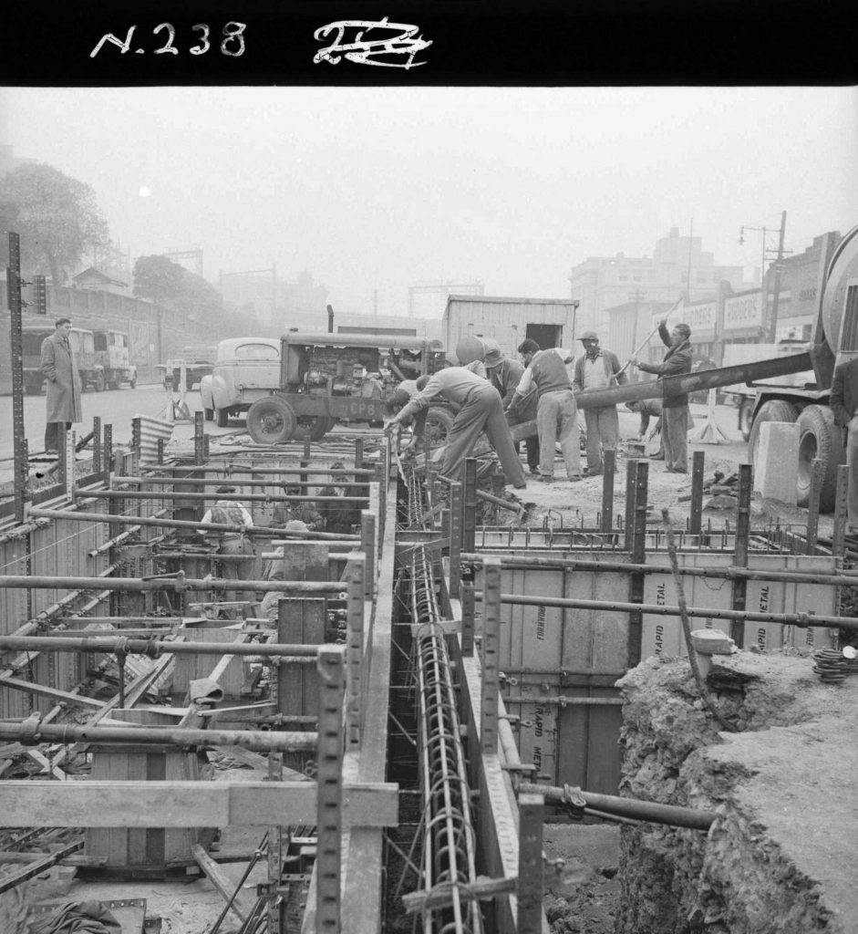 N238 Image showing an internal vibrator in operation with wall pour during construction of a weighbridge on Flinders Street