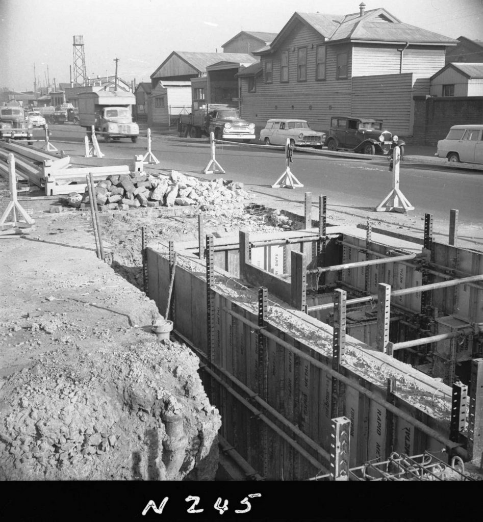 N245 Image showing the first stripping of outside wall shutterings and excavation for approaches during construction of a weighbridge on Flinders Street