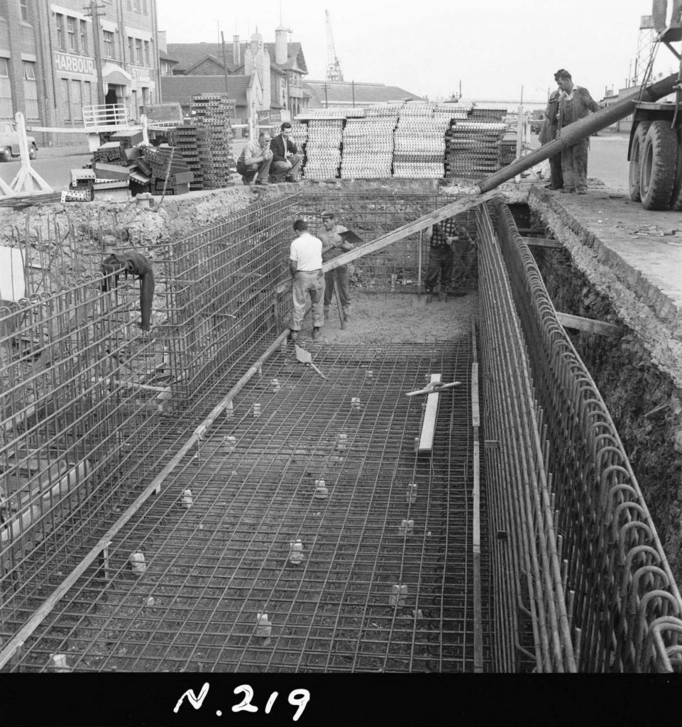 N219 Image showing an extension shute delivering ready-mix concrete to the far side of the floor, during construction of a weighbridge on Flinders Street