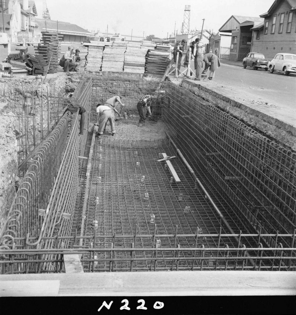 N220 Image showing spreading and compacting of the floor slab prior to screeding during construction of a weighbridge on Flinders Street