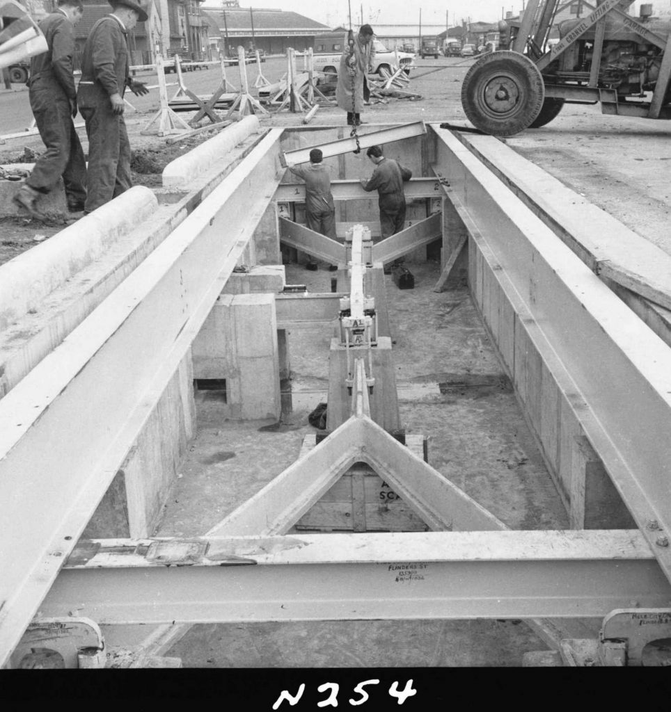 N254 Image showing installation of the main beams of a weighbridge during its construction on Flinders Street