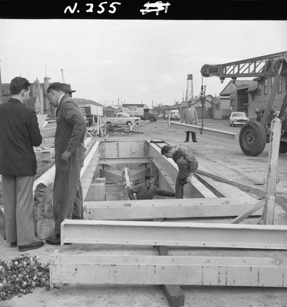 N255 Image showing installation of the main beams of a weighbridge during its construction on Flinders Street