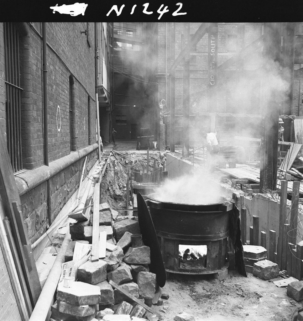 N1242 Image showing a wood burner on the excavation site in Arcade Alley