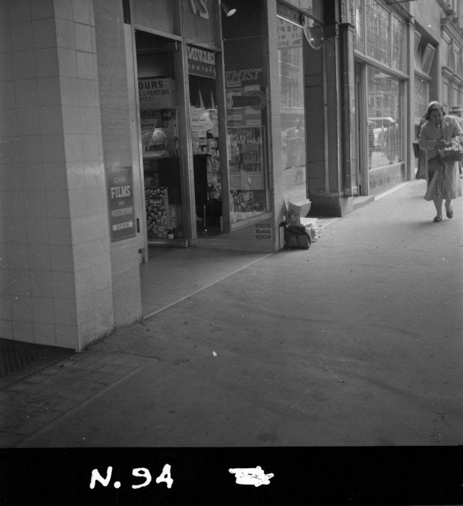 N94 Image showing a street view of a camera film store near 27 Elizabeth Street