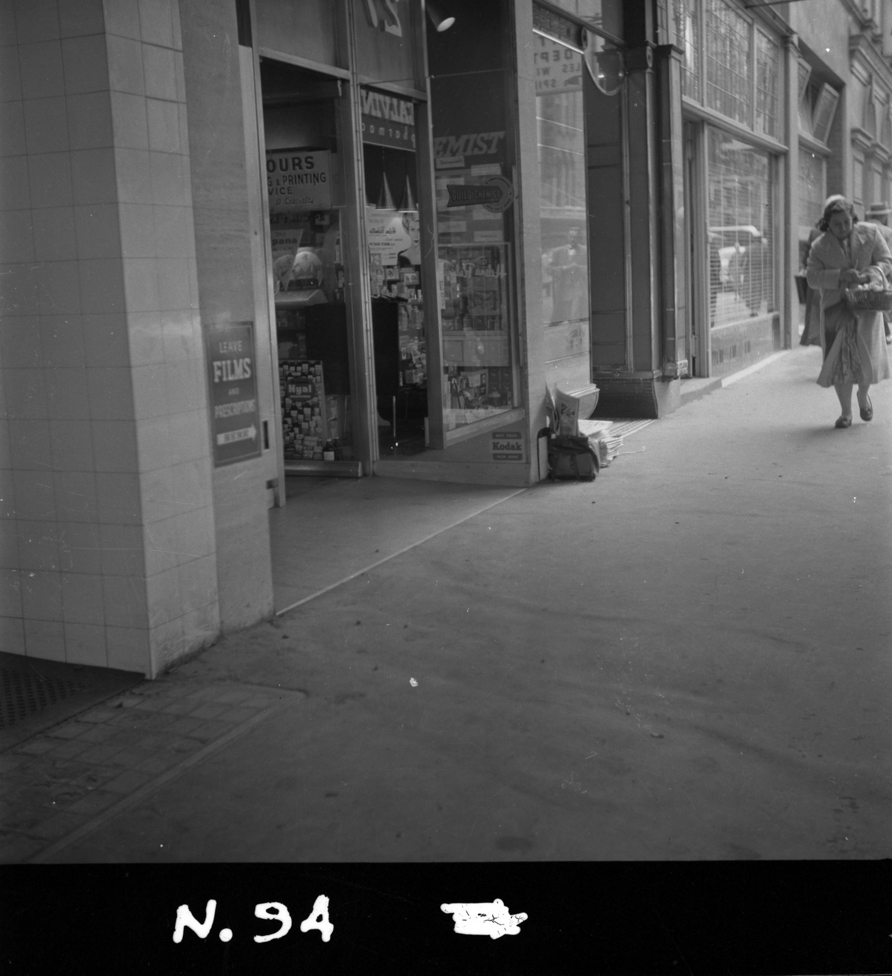 N94 Image showing a street view of a camera film store near 27