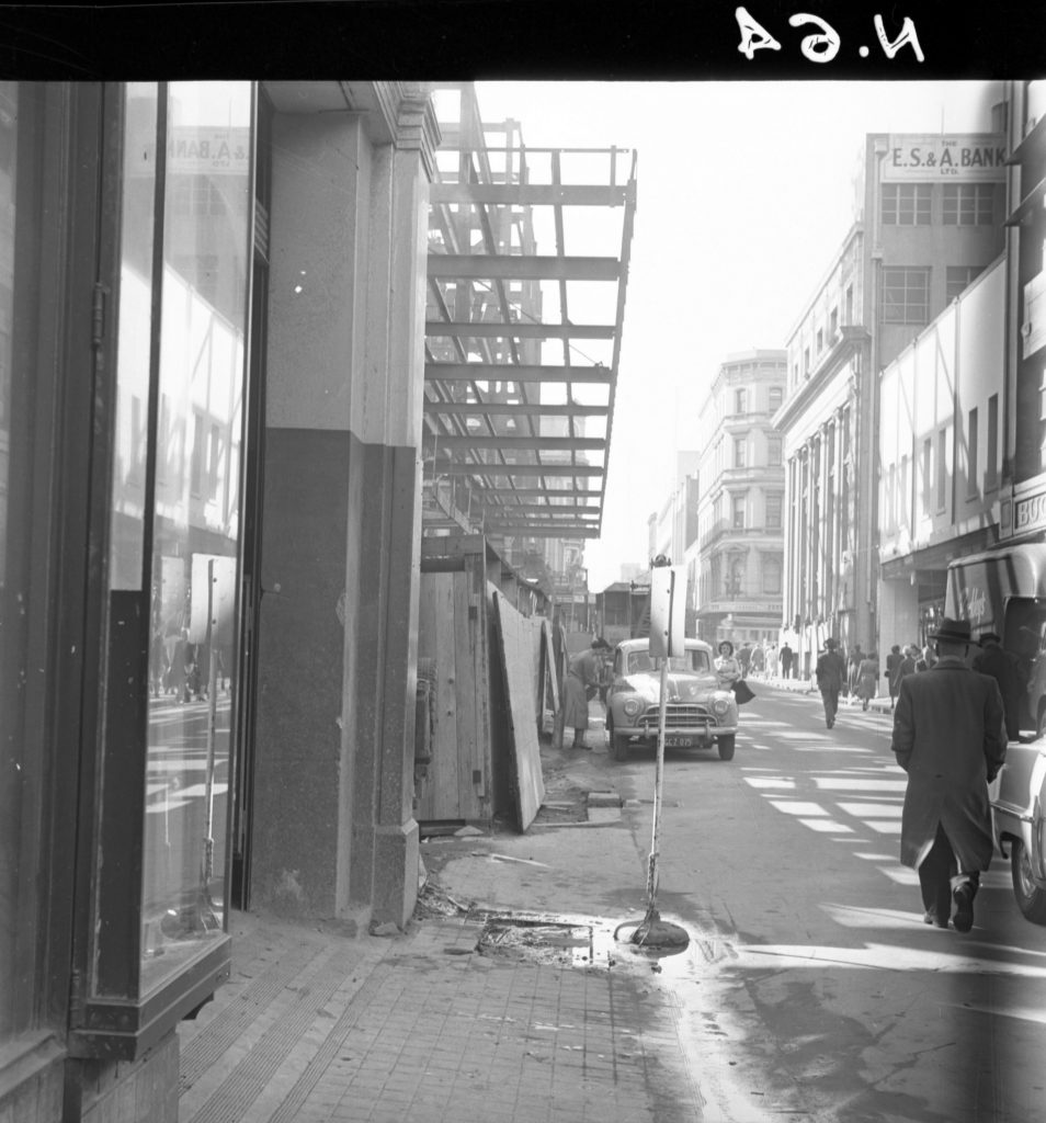 N64 Image showing hoardings on Little Bourke Street and Arcade Alley, looking towards Swanston Street