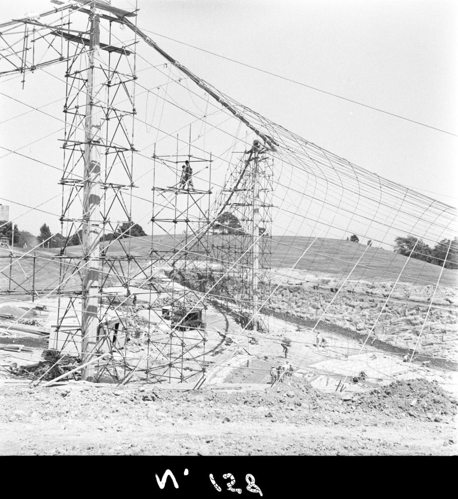 N158 Image showing dismantling of the main cable scaffolding during construction of the Sidney Myer Music Bowl