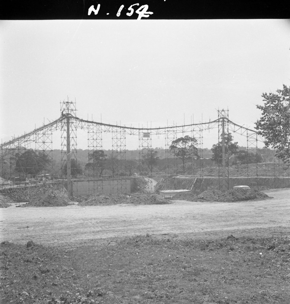 N154 Image showing pylons and tubular supporting framework during construction of the Sidney Myer Music Bowl