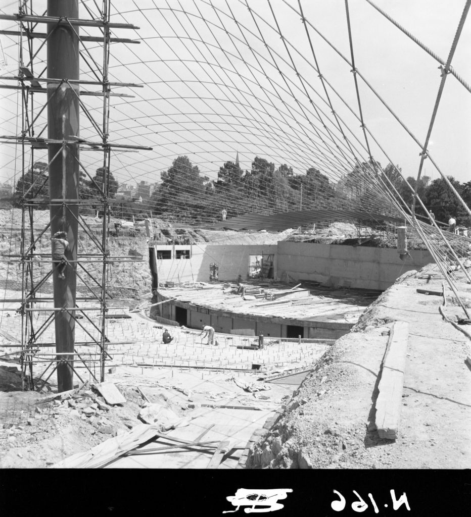 N166 Image showing the painting of seats and pedestals during construction of the Sidney Myer Music Bowl