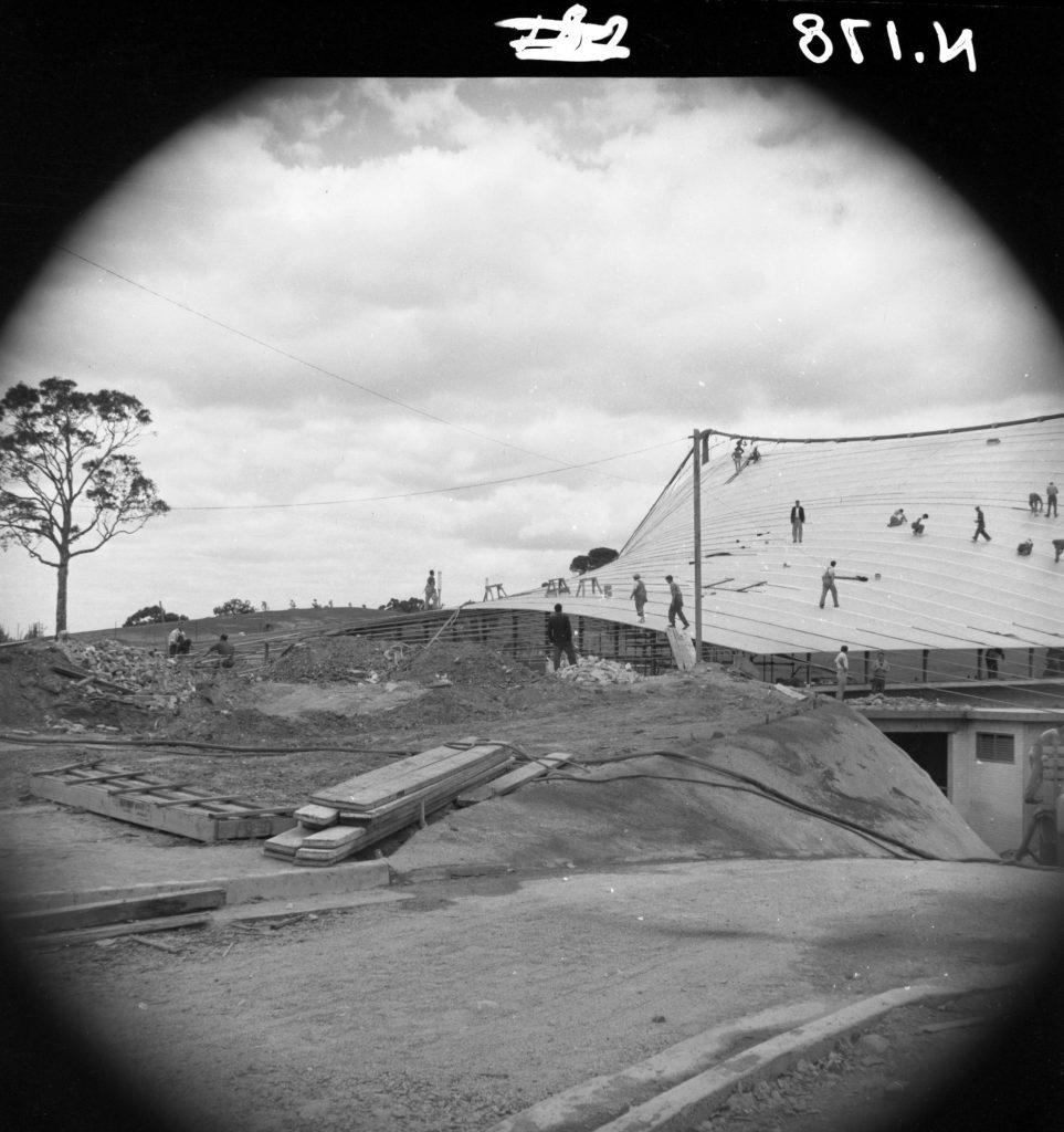 N178 Image showing primary cables at the end of roof sheeting during construction of the Sidney Myer Music Bowl