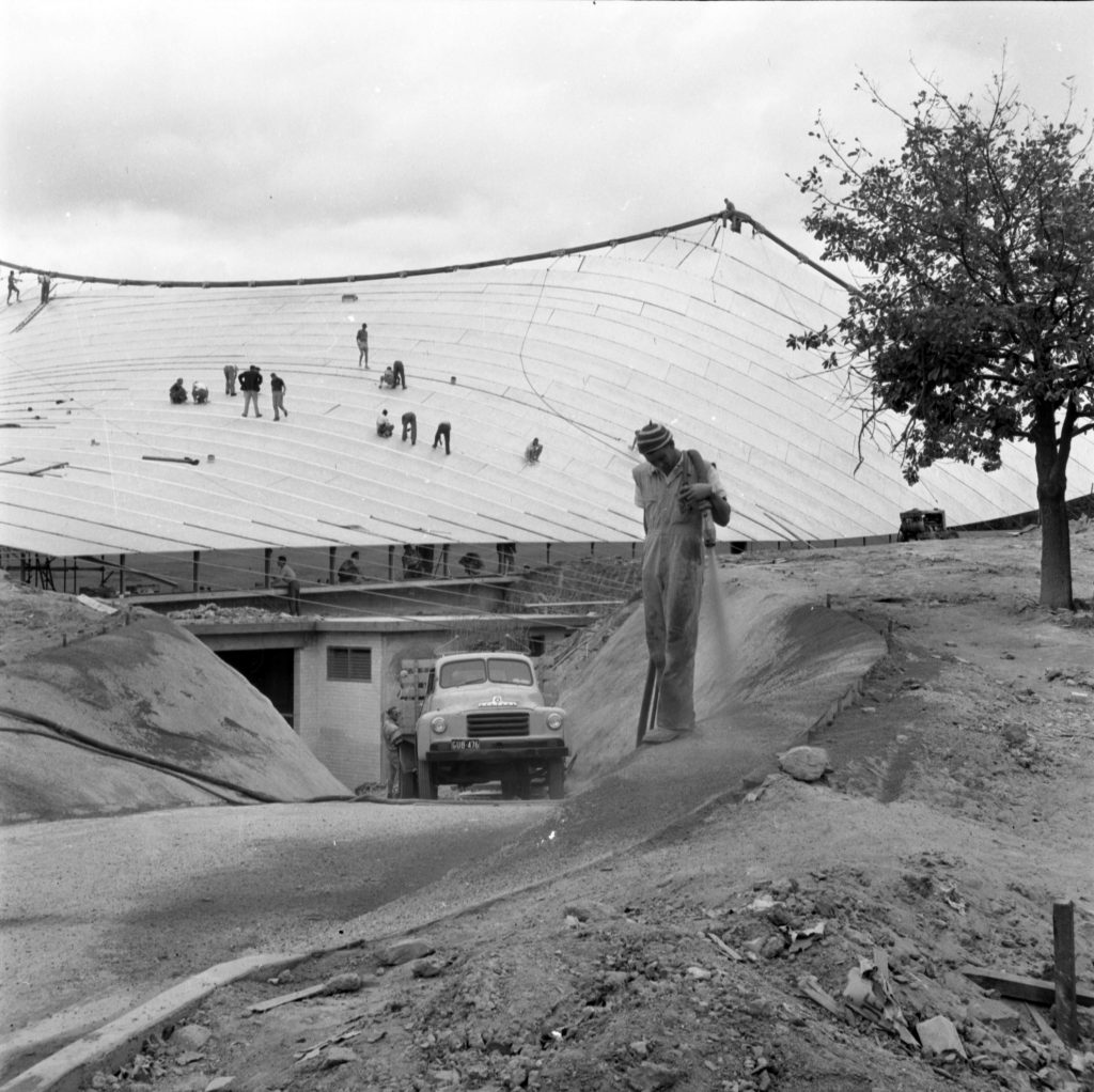 N179 Image showing cement gunning, roof sheeting and sealing of joints during construction of the Sidney Myer Music Bowl