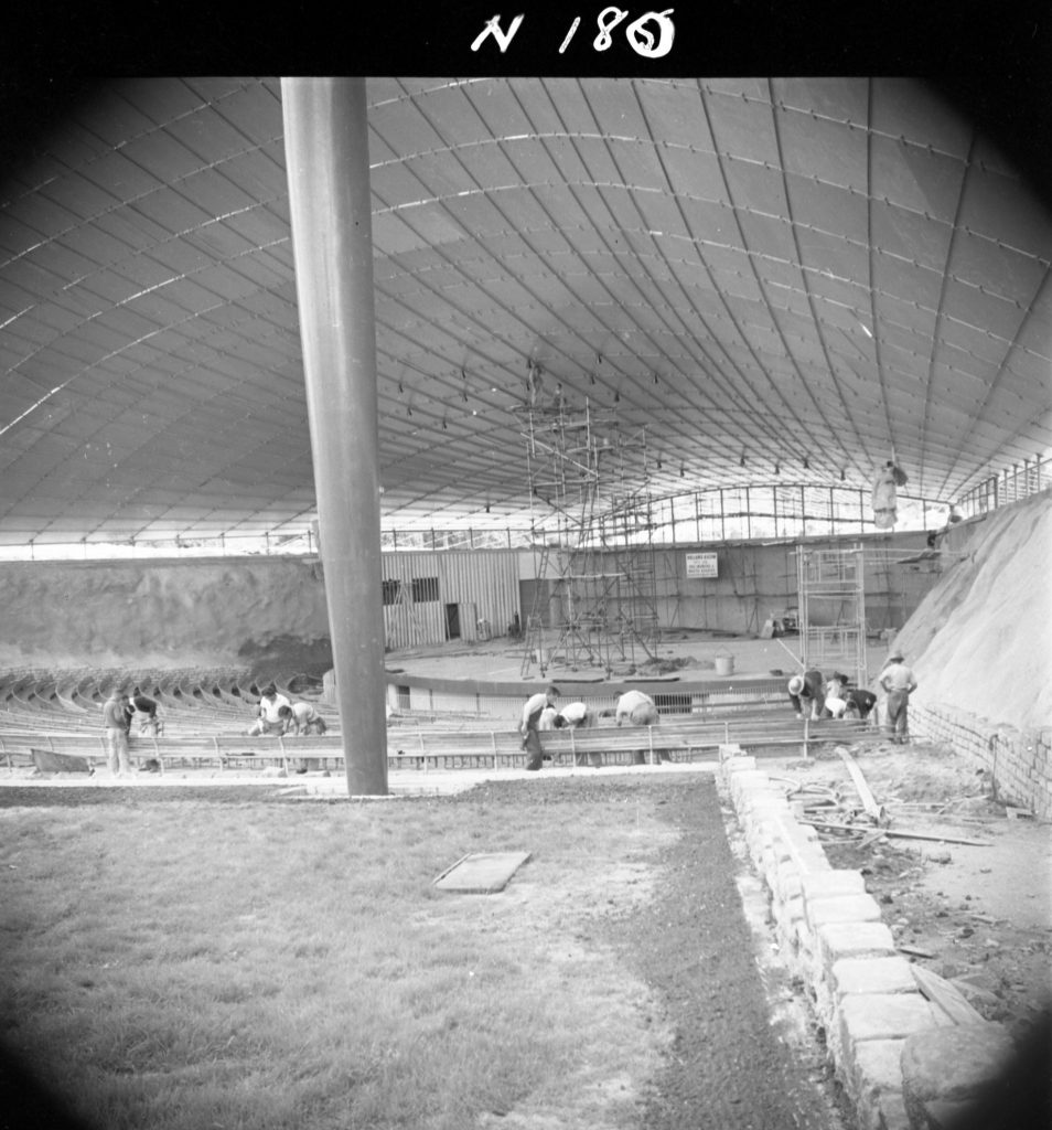 N180 Image showing the retaining wall and installation of seats during construction of the Sidney Myer Music Bowl