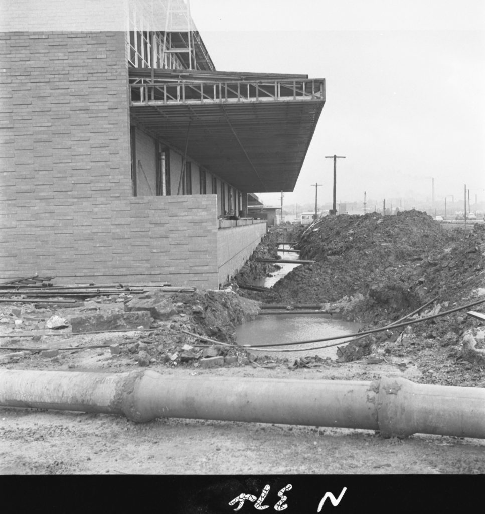 N374 Image showing drainage of water from a trench during sewer construction for the Fish Market on Footscray Road