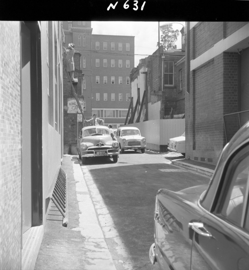 N631 Image showing Heffernan Lane, with shoring of corner building and newly-asphalted footpath