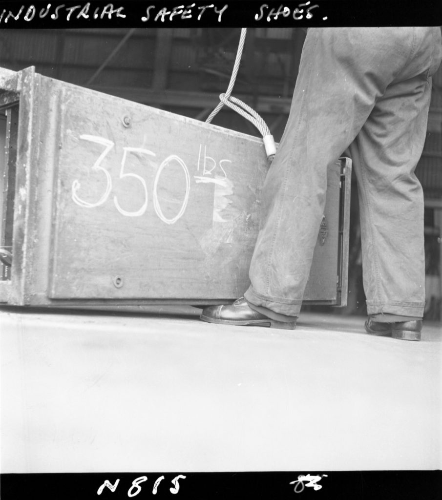 N815 Image showing testing of industrial safety shoes with weights