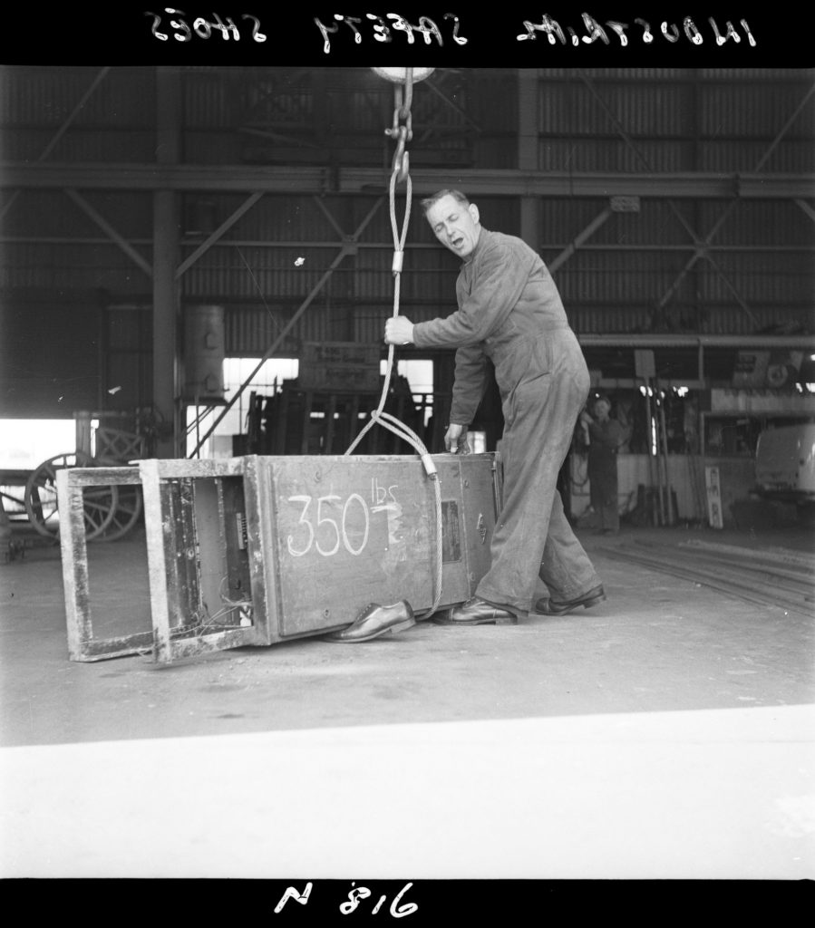 N816 Image showing testing of industrial safety shoes with weights