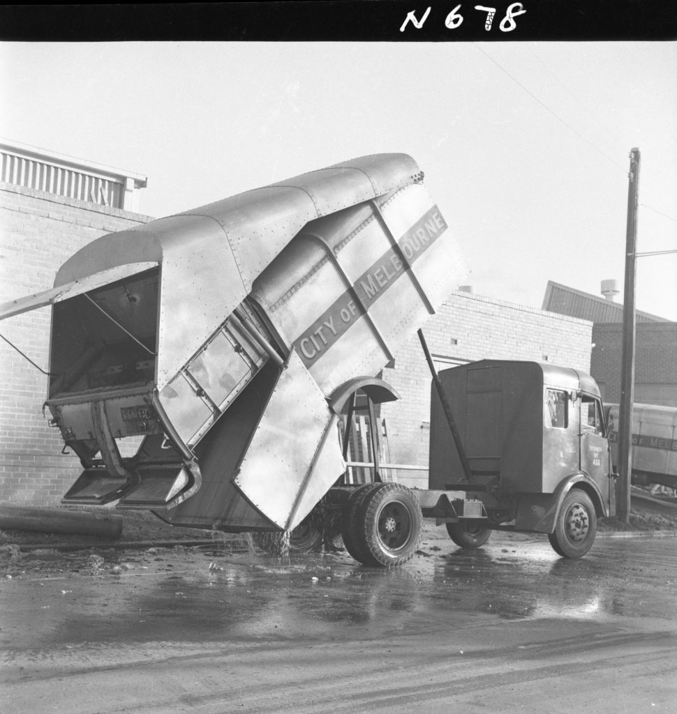 N678 Image showing a Karrier garbage truck being hosed down