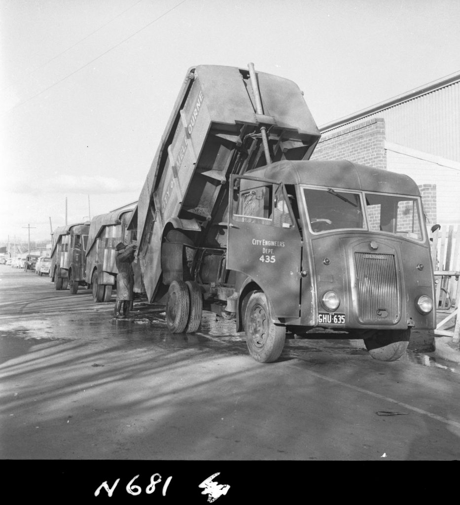 N681 Image showing a Karrier garbage truck being hosed down