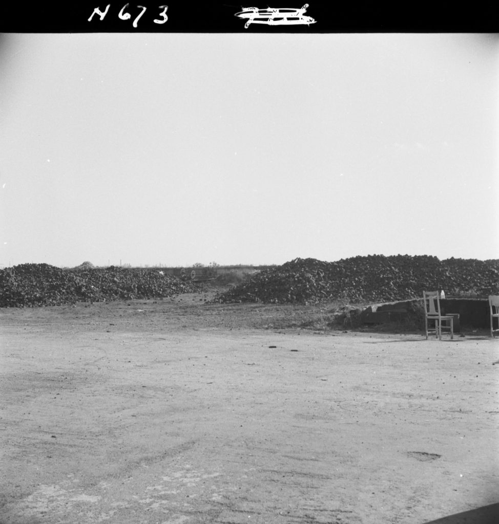 N673 Image showing a stockpile of woodblocks at the Dynon Road woodblock depot (with N672)