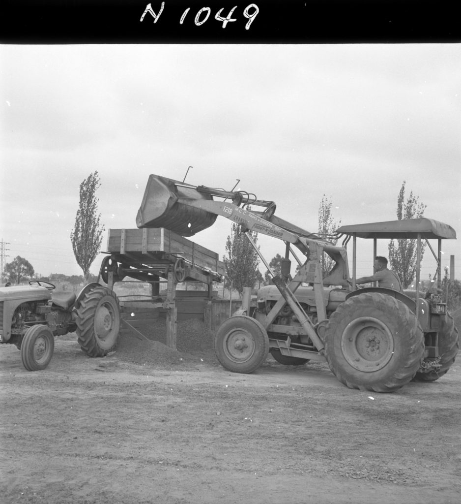 N1049 Image showing screening cinders for the Womens Athletic Ground in Royal Park