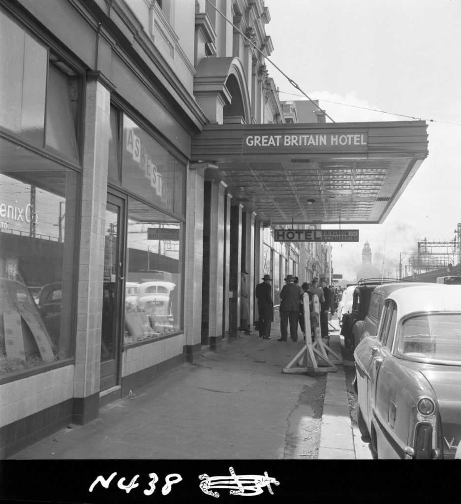 N438 Image showing the canopy of the Great Britain Hotel overhanging the new line of kerb, during construction of the Flinders Street overpass