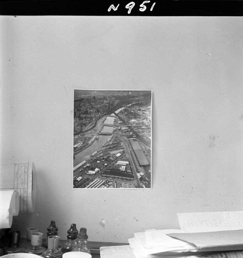 N951 Image showing an aerial photo of the Yarra River hanging above a desk