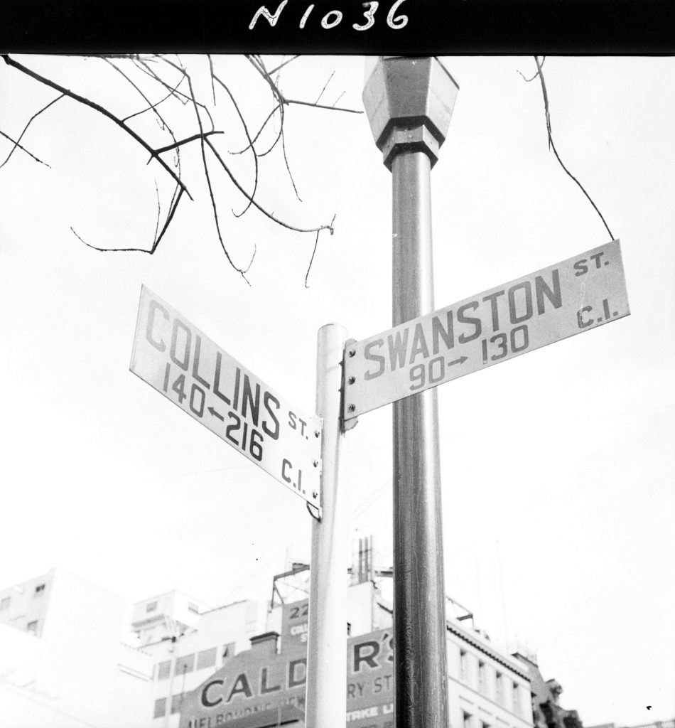 N1036 Image showing staggered street name plates for Swanston Street and Collins Street