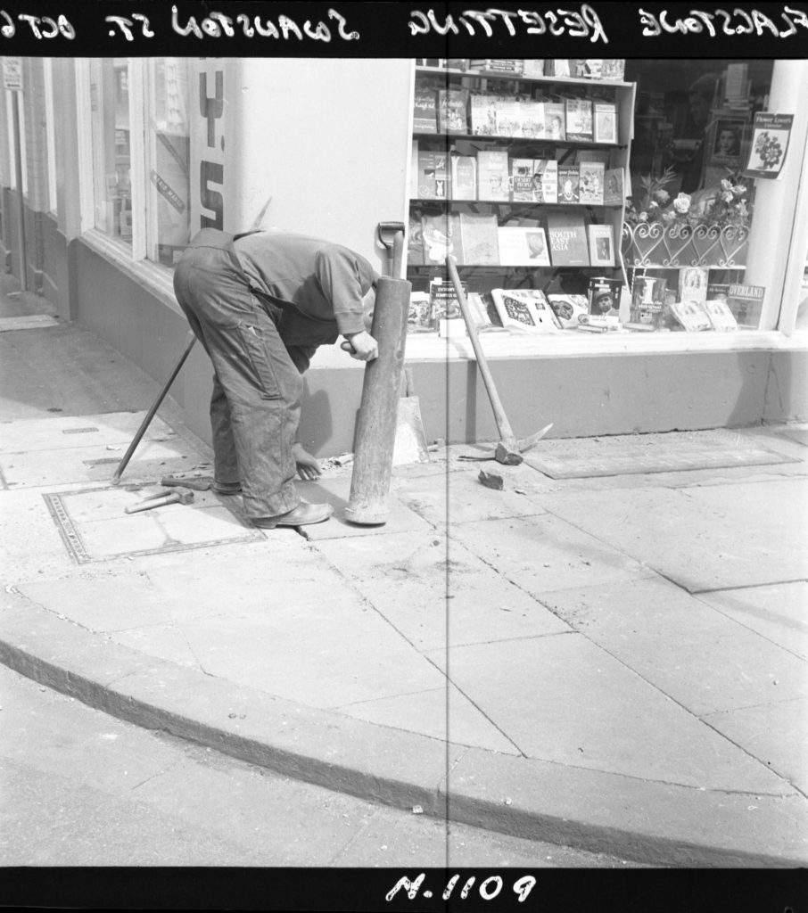 N1109 Image showing resetting of flagstones on Swanston Street