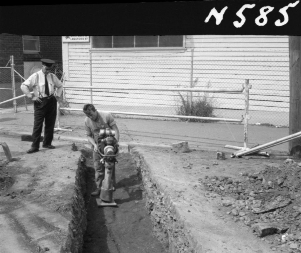 N585 Image showing ramming of backfill for an outfall pressure pipe