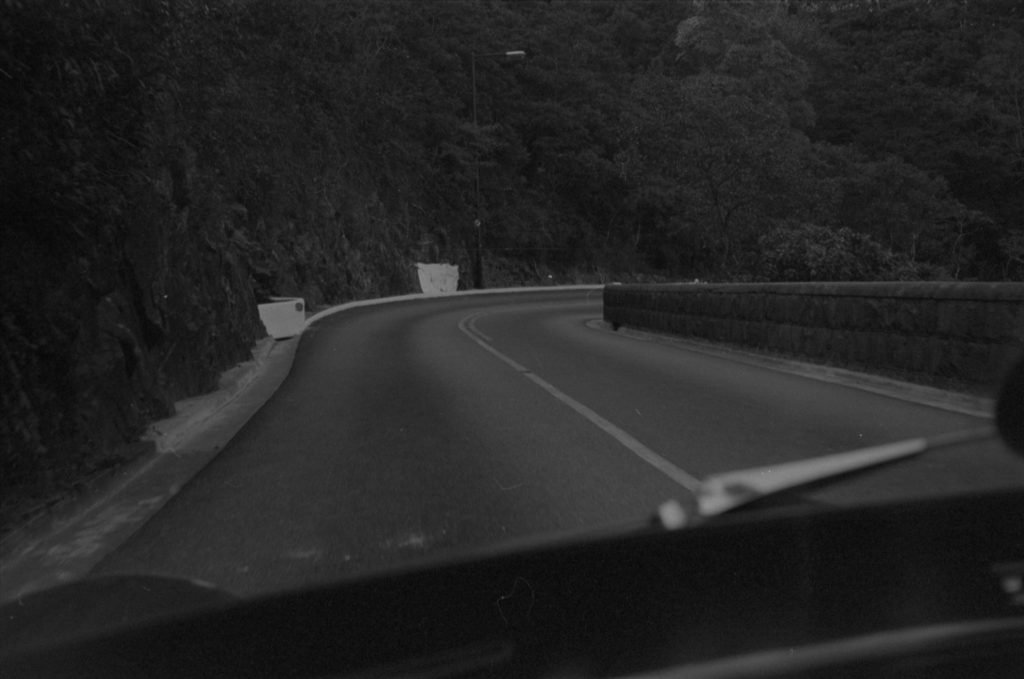 35A-13b Image of a bent road alongside a rocky cliff face in Hong Kong