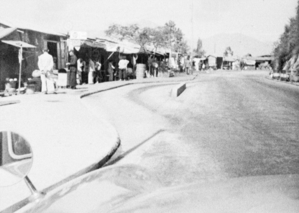 35A-28t Image showing a turning lane and roadside structures in rural Hong Kong