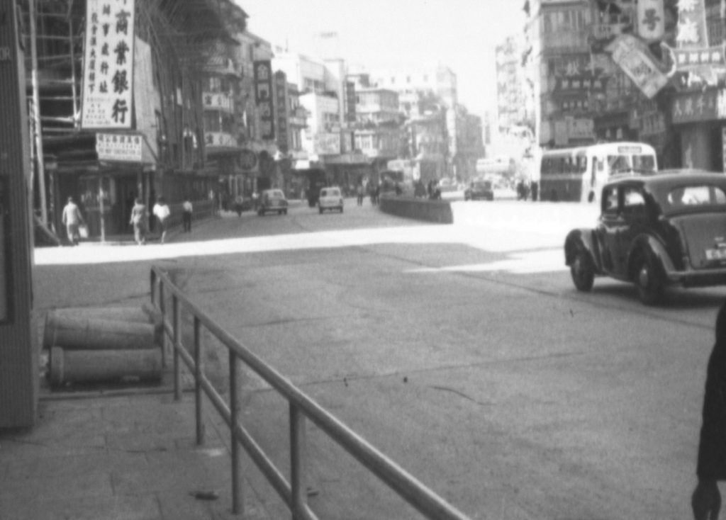 35A-30r Image of a street in Hong Kong, showing a median barrier